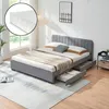 A bedroom scene featuring a bed with storage drawers, a nightstand, and a rug. Produktbild-Vorschau