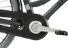 A close-up view of the crankset and chain guard of a bicycle. Voir les images du produit
