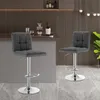 Two dark gray bar stools are shown in a modern bar or kitchen setting. Náhľad obrázku produktu