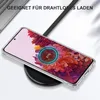 A clear phone case is shown on a wireless charger, with the phone displaying a charging animation. Produktbild-Vorschau