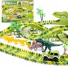 A dinosaur-themed race track toy set with dinosaurs, trees, and a car, displayed on a white background. Produktbild-Vorschau