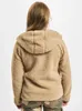 A person wearing a beige fleece jacket and camouflage pants, viewed from the back. Produktbild-Vorschau