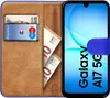 A book-style phone case with a Samsung Galaxy A17 5G phone inside, showing cards and banknotes in the case. Produktbild-Vorschau