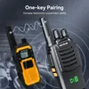 Two walkie-talkies are shown, one in the foreground and one in the background, with wavy lines indicating communication between them. Produktbild-Vorschau