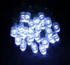 A close-up, slightly angled view of a string of white LED lights against a dark background. Produktbild-Vorschau