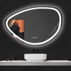 A modern bathroom vanity with a sink and a lit mirror. Produktbild-Vorschau