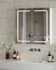 A modern bathroom vanity with a lighted medicine cabinet above a sink. Voir les images du produit