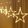 A close-up shot of star-shaped LED lights hanging in front of a curtain. Podgląd zdjęcia produktu