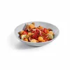 A bowl of fruit salad with almonds. Produktbild-Vorschau