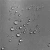 Close-up of water droplets on a gray fabric surface. Produktbild-Vorschau