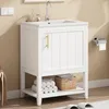 A white bathroom vanity with a golden handle and a ceramic sink is shown in a well-lit room. Voir les images du produit