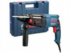 A Bosch Professional rotary hammer drill and its blue carrying case are shown against a white background. Produktbild-Vorschau