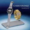 Two Casio vintage watches and a smartphone are displayed against a blue gradient background. Produktbild-Vorschau