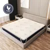 A mattress topper is placed on a bed in a bedroom setting. Náhled obrázku produktu