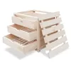 A wooden storage unit with three drawers and a slatted side. Produktbild-Vorschau