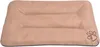 A beige dog bed with a paw print logo. Náhľad obrázku produktu