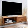 A modern wooden TV stand mounted on a textured wall, holding a large flat-screen TV. Produktbild-Vorschau