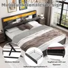 A bedroom scene featuring a bed with storage and LED lighting. Produktbild-Vorschau