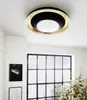 A modern living room with a large window and a ceiling light. Náhled obrázku produktu