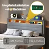A bed with a headboard featuring integrated storage and lighting. Náhled obrázku produktu