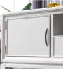 A close-up view of a white cabinet door with a black handle. Produktbild-Vorschau