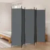 A gray folding screen in a bedroom setting next to a bed. Anteprima dell’immagine prodotto