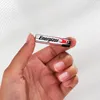 A hand holding a single AAA battery. Anteprima dell’immagine prodotto