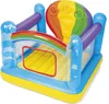 An inflatable bouncy castle with a rainbow and hot air balloon theme. Voir les images du produit