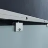 A close-up view of a sliding glass door track and mounting hardware. Produktbild-Vorschau
