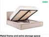 A bed frame with the mattress lifted to reveal storage space underneath. Produktbild-Vorschau