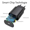 A disassembled black power adapter showing its internal circuit board with labels indicating smart chip technology features. Produktbild-Vorschau