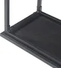A close-up view of the corner of a black wood grain shelf and its dark gray metal frame. Produktbild-Vorschau