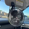 A car interior with a fan clipped to the sun visor. Anteprima dell’immagine prodotto
