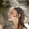 A woman is showering with a headset on, demonstrating its waterproof feature. Produktbild-Vorschau