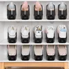A shelf in a white cabinet filled with black shoe organizers, each holding a pair of shoes. Náhled obrázku produktu