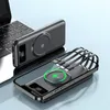 A black wireless power bank with integrated cables is shown on top of a smartphone, with a laptop in the background. Produktbild-Vorschau