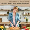 A woman is chopping vegetables in a kitchen. Produktbild-Vorschau