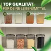 A display of clear plastic food storage containers filled with various food items, arranged on two shelves. Produktbild-Vorschau