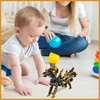 A baby and an adult are playing with toys on the floor. Náhled obrázku produktu