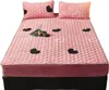 A pink bed set with heart patterns, including two pillows and a fitted sheet, is displayed on a bed frame. Náhled obrázku produktu