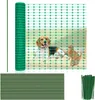 A roll of green mesh fencing is shown, along with a bundle of green stakes. A dog and a cat are visible through the mesh, suggesting its use as a pet barrier. Náhľad obrázku produktu