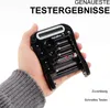 A hand holding a digital battery tester with multiple batteries inserted. Podgląd zdjęcia produktu