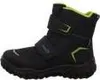 A side view of a black winter boot with green accents. Voir les images du produit