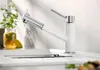 A modern kitchen faucet in a sink. Anteprima dell’immagine prodotto