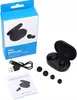 A set of black wireless earbuds with their charging case, charging cable, and user manual, along with a blue product box. Podgląd zdjęcia produktu