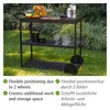 A black outdoor kitchen serving cart is shown on a grassy lawn with bushes in the background. Produktbild-Vorschau