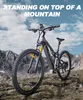 An electric mountain bike is parked on a rocky mountain slope with a cloudy sky in the background. Produktbild-Vorschau