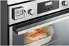 A digital meat thermometer is attached to the front panel of an oven, with the probe inserted into a roast in a baking dish inside the oven. Anteprima dell’immagine prodotto