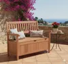A wooden storage bench on a patio with a view of the sea and surrounding landscape. Produktbild-Vorschau