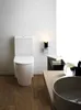 A modern bathroom with a toilet and sink. Produktbild-Vorschau